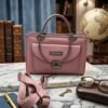 Stylish Women's Pink Leather Handbag with Metal Handle & Shoulder Strap